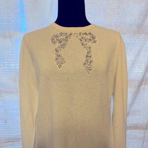 White cashmere sweater.